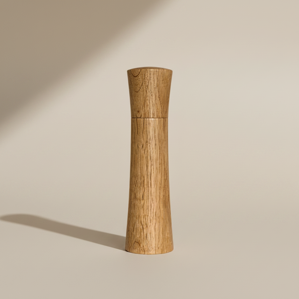 Large Pebble Studio Salt & Pepper Mill in American Oak. Minimalist design on aneutral background