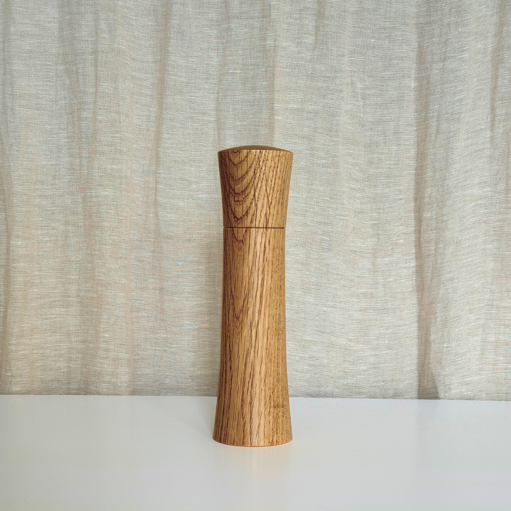 MediumPebble Studio Salt & Pepper Mill in American Oak. Minimalist design on a neutral background