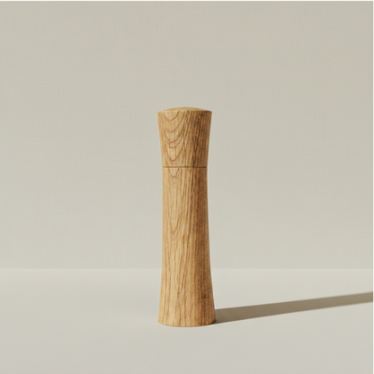 Medium Pebble Studio Salt & Pepper Mill in American Oak. Minimalist design on a neutral background
