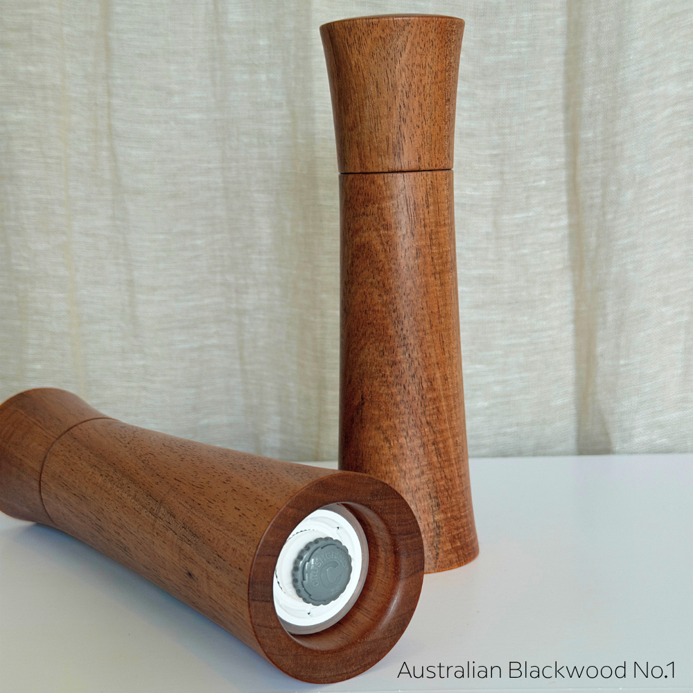 Pebble Studio Salt & Pepper Mills in Blackwood showcasing the Crushgring mechanism.