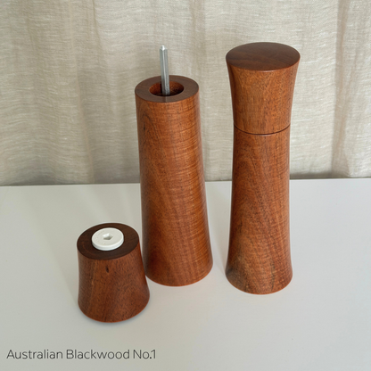 Pebble Studio Salt & Pepper Mills in Blackwood. One grinder with the top sitting next to the base.