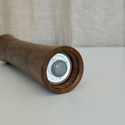 Pebble Studio handcrafted Walnut salt & pepper mill in Medium showing the Crushgrind Mechanism