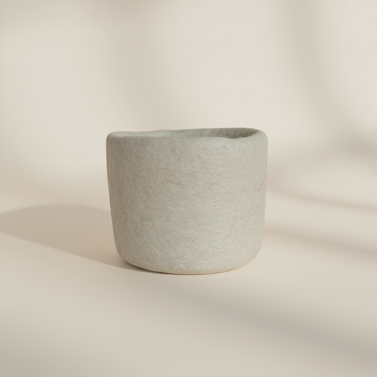 Loft Wool Felt Extra Small Basket  in Snow- natural white wool felt catchall basket on a light background