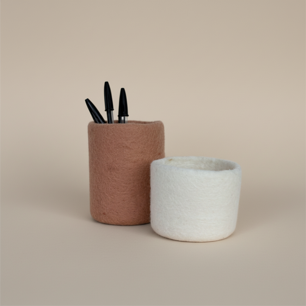 soft blush and snow handcrafted wool storage on light background