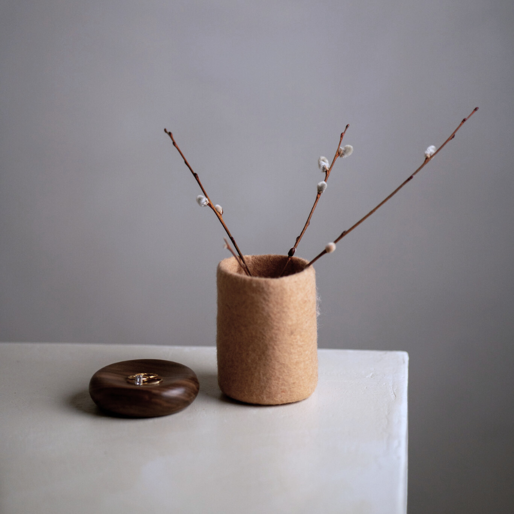 soft blush handcrafted wool vase benchtop next to a wood dish