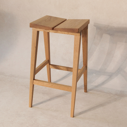 Wooden bar stool on a neutral background