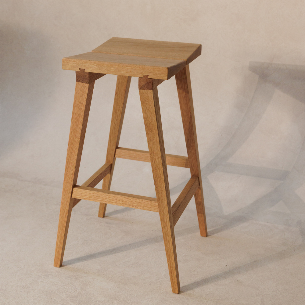 Wooden bar stool on a plain background
