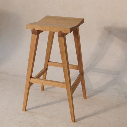 Wooden bar stool on a plain background
