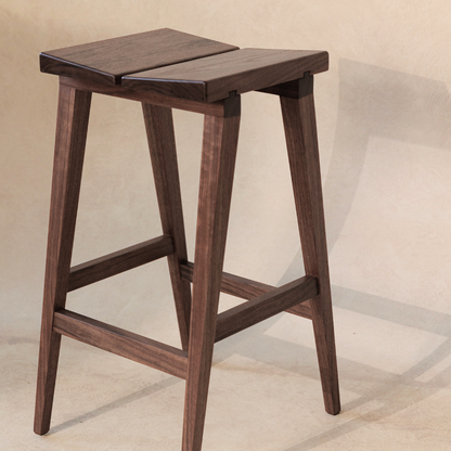 Wooden bar stool on a beige background