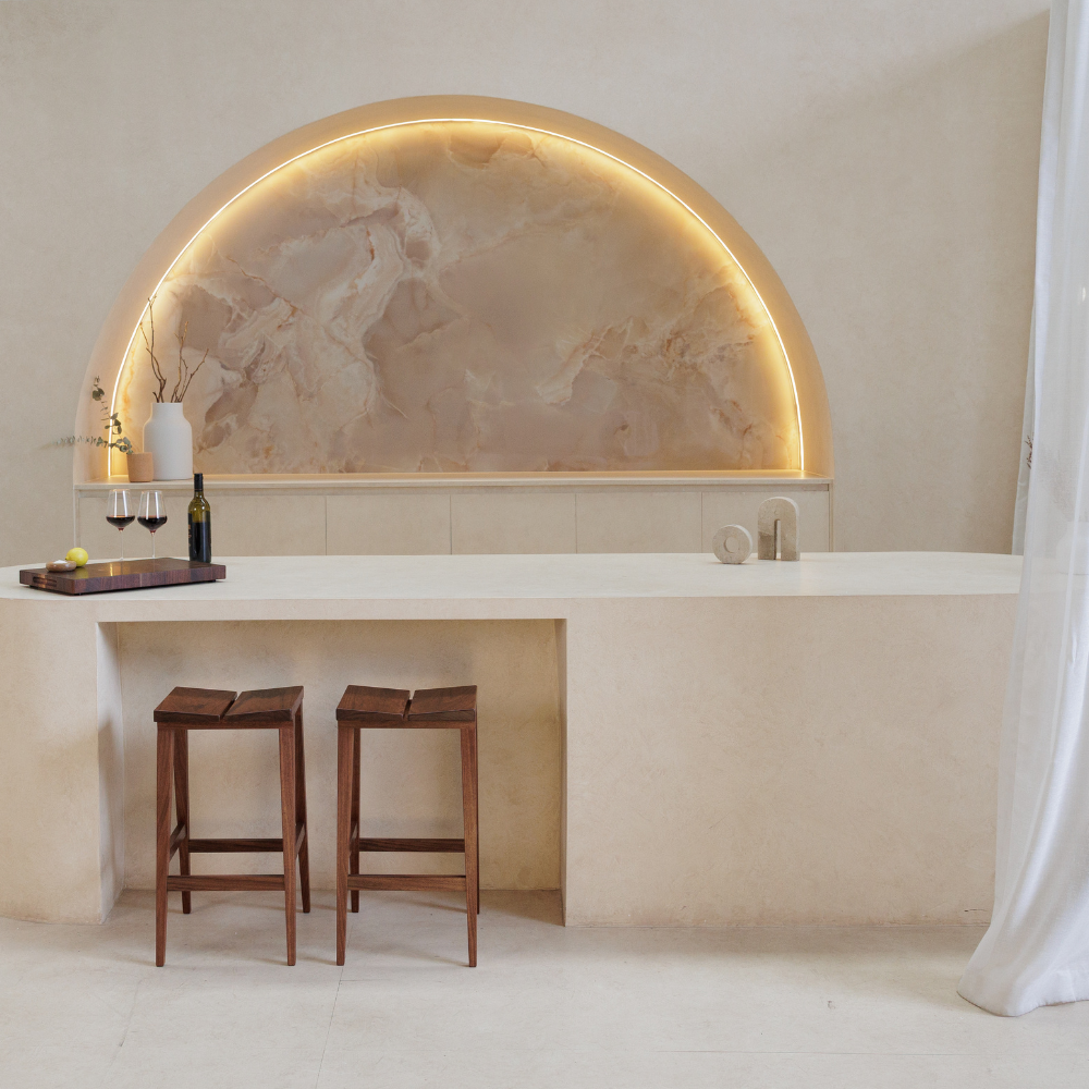 Modern kitchen with marble backsplash and bar stools