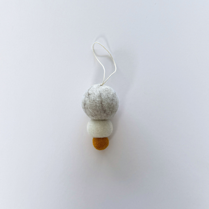 Pebble Studio felt Christmas decoration on a white background