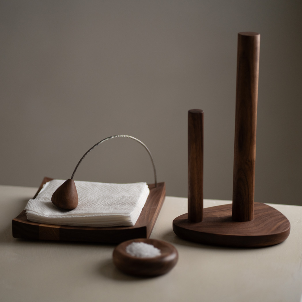 Wooden kitchen set with paper towel holder, salt dish, and napkin holder on a neutral background