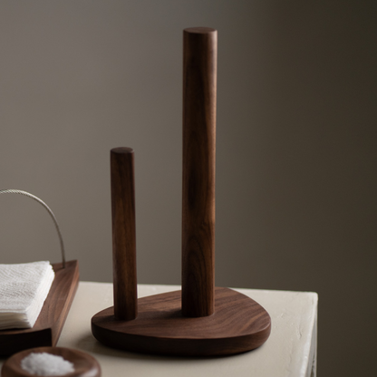 Wooden paper towel holder on a neutral background