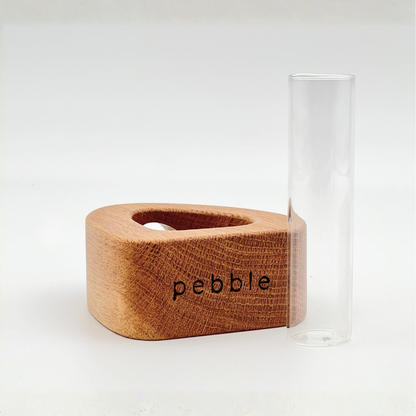 Bottom of wood vase with "Pebble" logo on the bottom