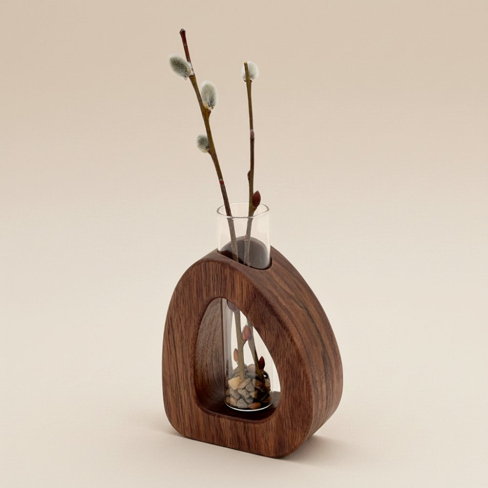 Wooden vase with glass insert containing willow branches on a beige background