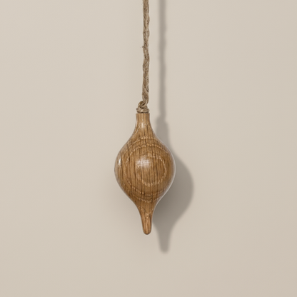 Wooden hanging ornament on a beige background