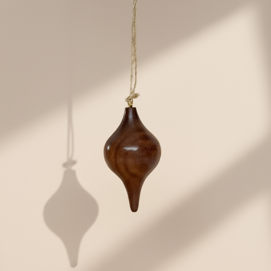 Hand turned Christmas ornament in Walnut wood. Made in Australia and designed for slow living