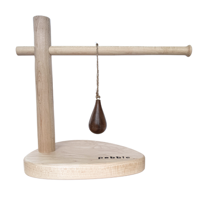 Hand turned walnut timber ornament in teardrop shape with jute loop. Pebble Studio sustainable Christmas decor