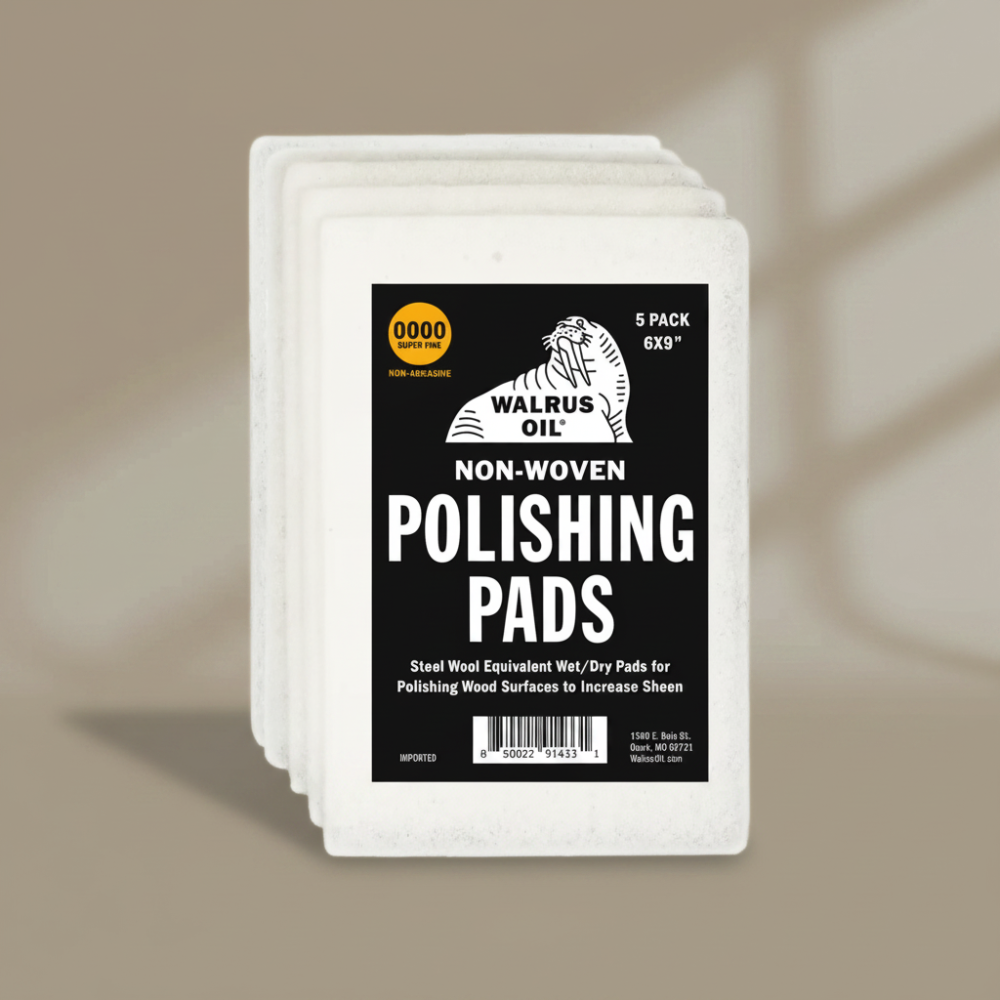 Pack of Walrus Oil non-woven polishing pads on a beige background