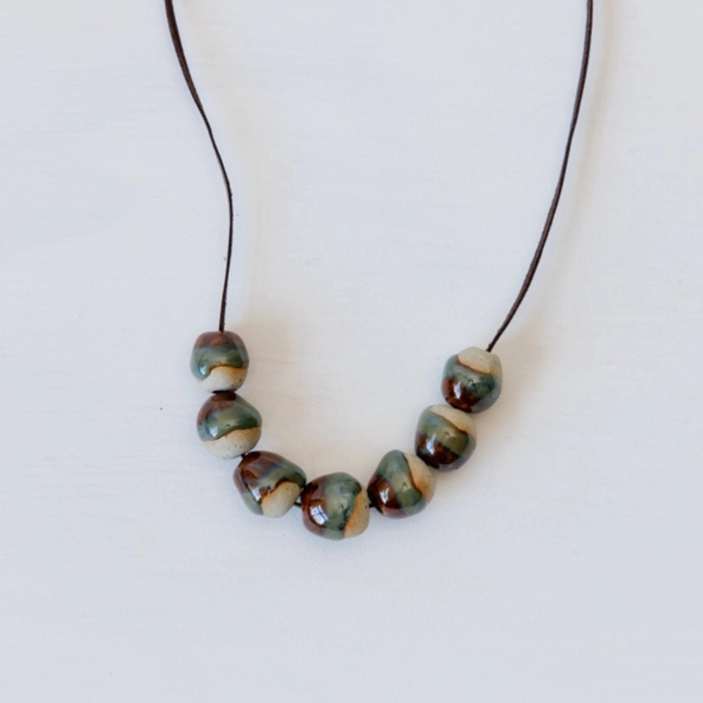 Necklace with ceramic beads on a white background