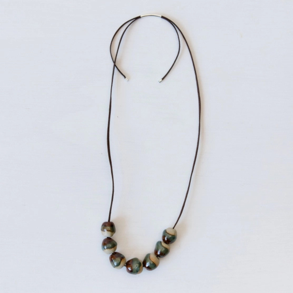 Necklace with ceramic beads on a white background
