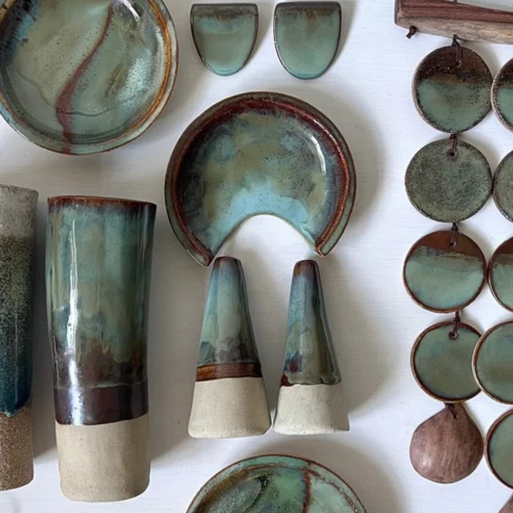 Collection of ceramic items with green and brown glaze on a white background