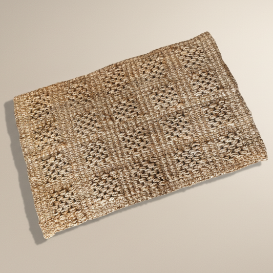 Woven natural fibre mat on a beige background