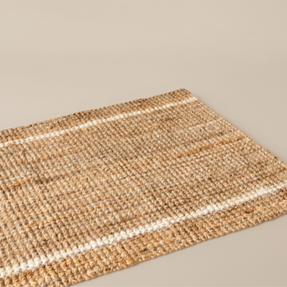 Woven mat with striped pattern on a neutral background