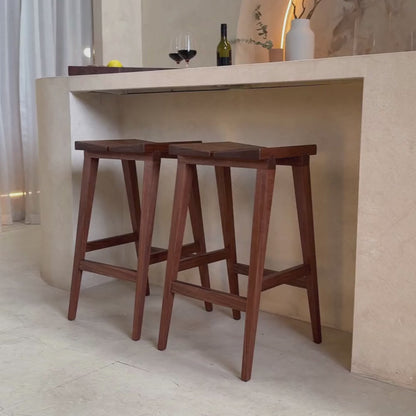 Walnut bat stools at a bench